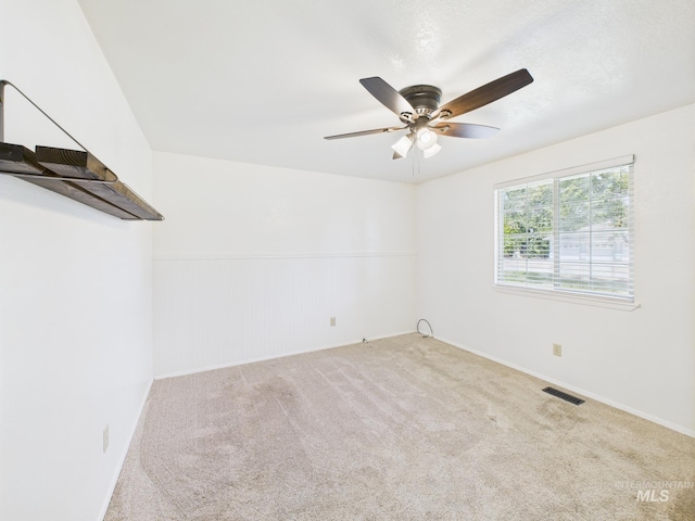 1673 Thomas, Emmett, ID 83617 - unfurnished room with carpet floors, a ceiling fan, and wainscoting