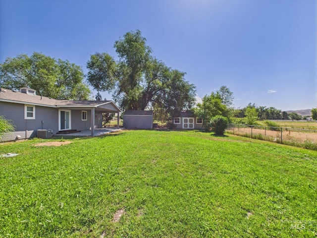 1673 Thomas, Emmett, ID 83617 - view of yard with a storage unit, a patio area, and a carport