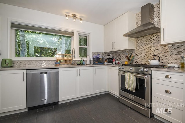 2844 Parke Circle Dr, Boise, ID 83705 - kitchen featuring stainless steel appliances, wall chimney exhaust hood, white cabinetry, and tasteful backsplash