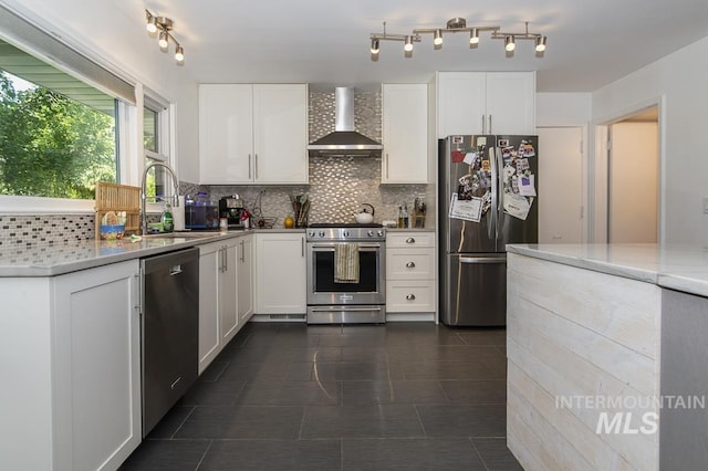 2844 Parke Circle Dr, Boise, ID 83705 - kitchen featuring stainless steel appliances, wall chimney range hood, decorative backsplash, and white cabinets