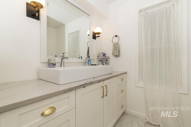 2844 Parke Circle Dr, Boise, ID 83705 - bathroom with marble look tile flooring and vanity
