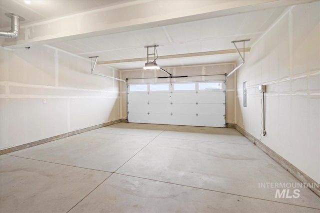 garage featuring baseboards and a garage door opener