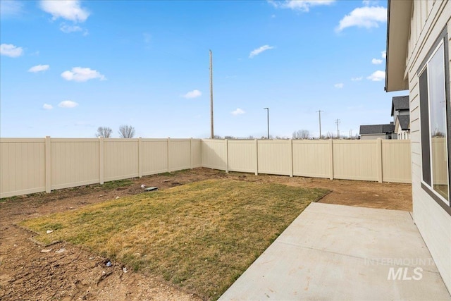 view of yard featuring a fenced backyard and a patio