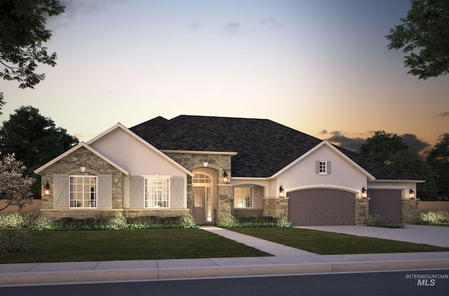 view of front of home with stone siding, stucco siding, an attached garage, and a front lawn