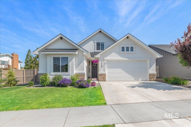 11328 W Campanula Dr, Star, ID 83669 - view of front of property with stucco siding, stone siding, driveway, and an attached garage
