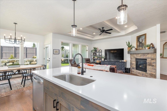 11328 W Campanula Dr, Star, ID 83669 - kitchen with a sink, light countertops, dark wood-type flooring, stainless steel dishwasher, and a textured ceiling