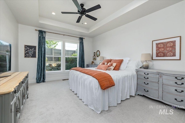 11328 W Campanula Dr, Star, ID 83669 - bedroom with light colored carpet, baseboards, recessed lighting, a raised ceiling, and a ceiling fan