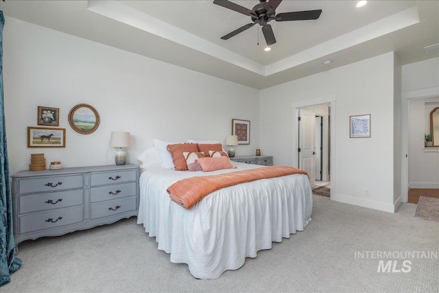 11328 W Campanula Dr, Star, ID 83669 - bedroom with a raised ceiling, light colored carpet, recessed lighting, baseboards, and a ceiling fan