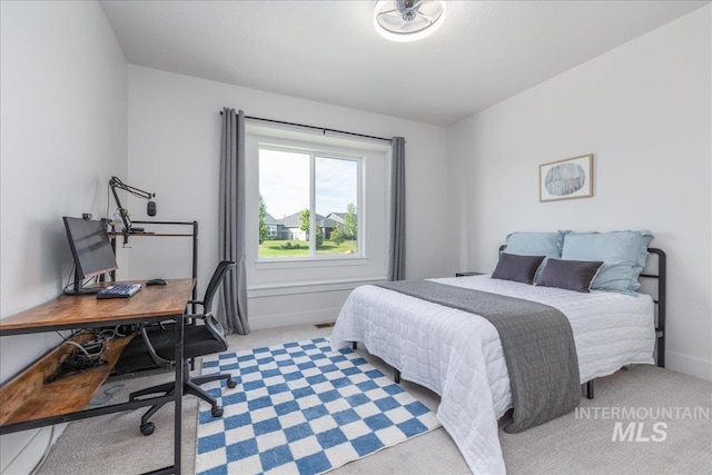 11328 W Campanula Dr, Star, ID 83669 - bedroom featuring light colored carpet, an office area, and baseboards