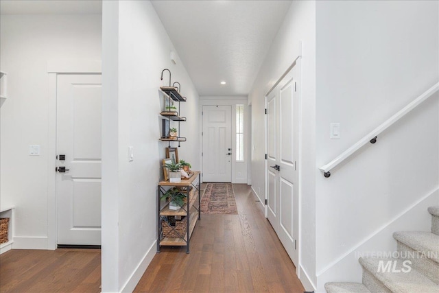 11328 W Campanula Dr, Star, ID 83669 - entryway featuring wood-type flooring, stairway, baseboards, and recessed lighting