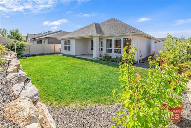 11328 W Campanula Dr, Star, ID 83669 - back of house with roof with shingles, a patio area, and stucco siding