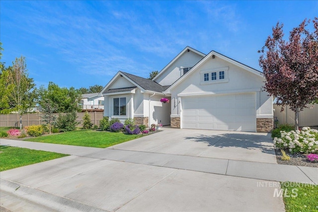 11328 W Campanula Dr, Star, ID 83669 - ranch-style house featuring stone siding, stucco siding, driveway, and an attached garage