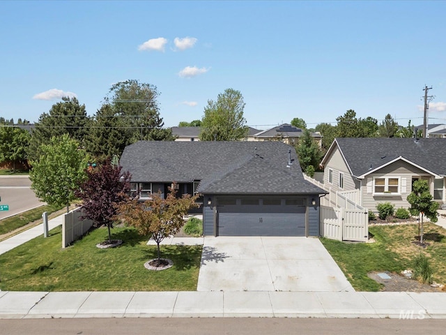 view of front of house with concrete driveway, a garage, and roof with shingles