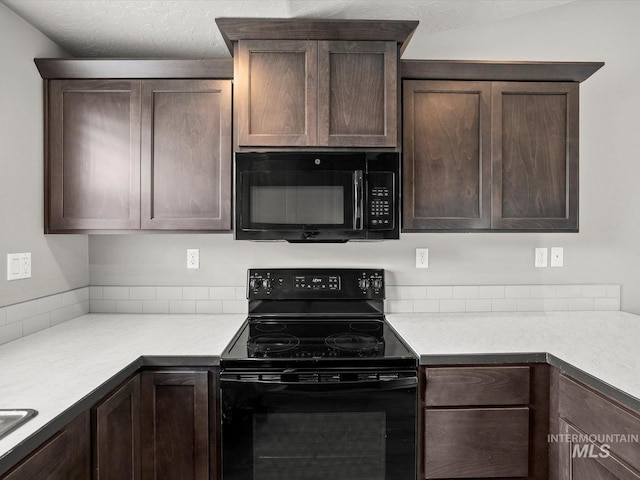 kitchen with black appliances, dark brown cabinets, and light countertops