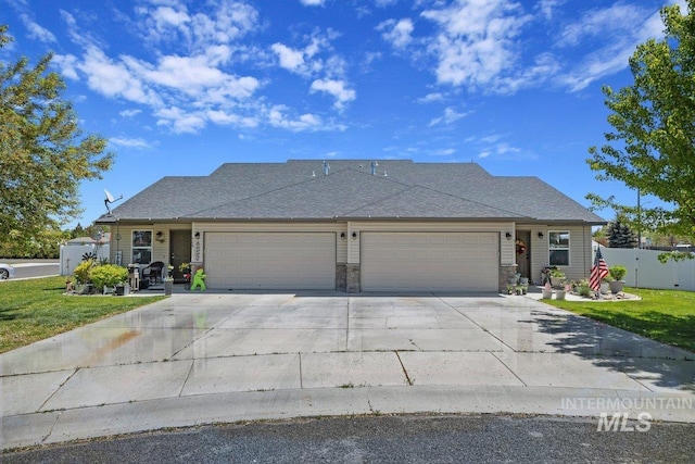 909 Arrow Wood Ct, Twin Falls, ID 83301 - view of front facade featuring a garage, driveway, and stone siding