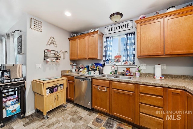 909 Arrow Wood Ct, Twin Falls, ID 83301 - kitchen featuring dishwasher, a sink, recessed lighting, light countertops, and baseboards