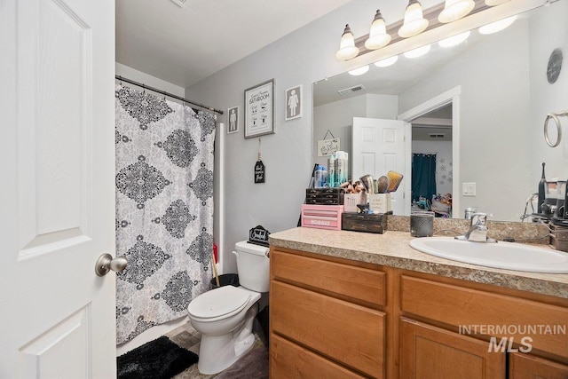 909 Arrow Wood Ct, Twin Falls, ID 83301 - bathroom with toilet, vanity, and a shower with shower curtain