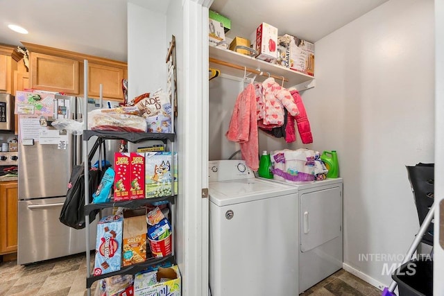 909 Arrow Wood Ct, Twin Falls, ID 83301 - laundry area featuring washing machine and dryer and baseboards