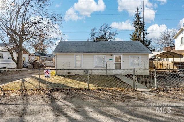 rear view of property with a carport