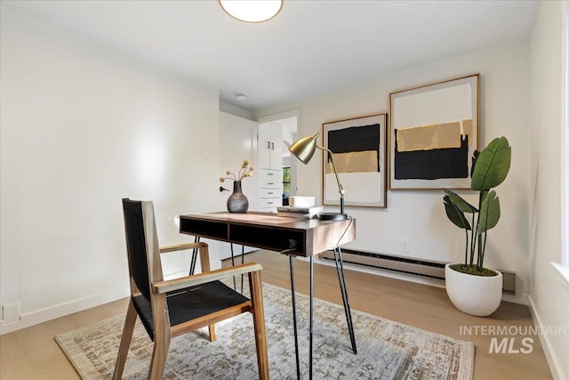 1223 N Mckinney St, Boise, ID 83704 - office area with baseboards, baseboard heating, and wood finished floors