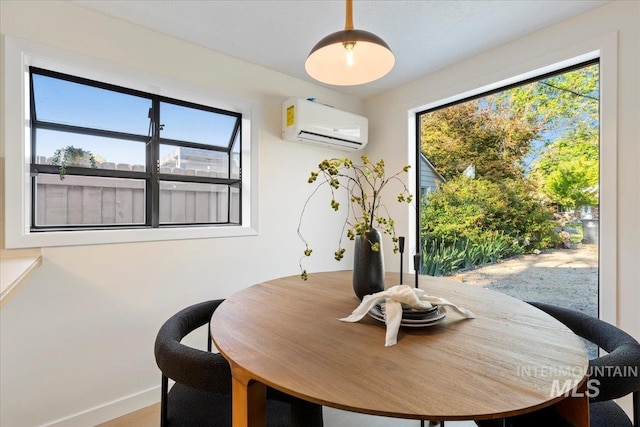1223 N Mckinney St, Boise, ID 83704 - dining area featuring an AC wall unit and baseboards