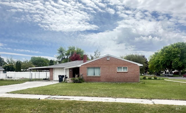 425 W 20th St, Burley, ID 83318 - ranch-style house featuring a garage, brick siding, concrete driveway, a chimney, and a carport