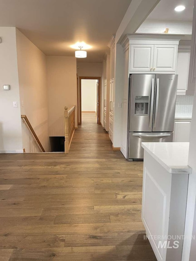 hallway featuring light hardwood / wood-style flooring