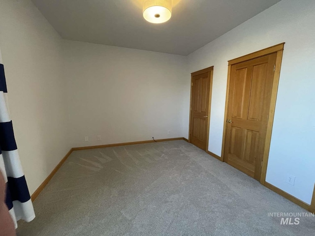 unfurnished bedroom with carpet