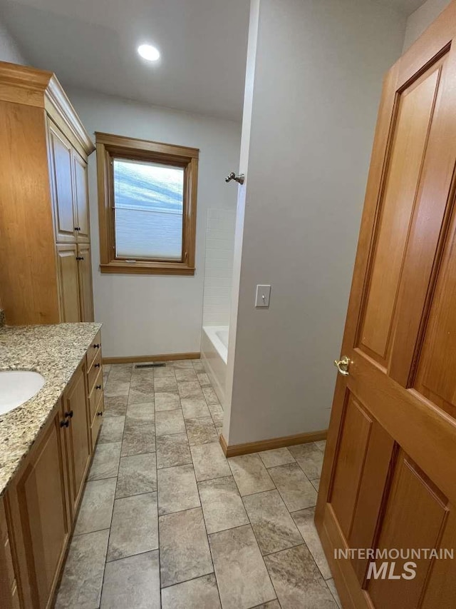 bathroom featuring vanity and shower / washtub combination