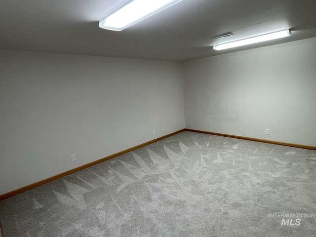 spare room featuring carpet flooring