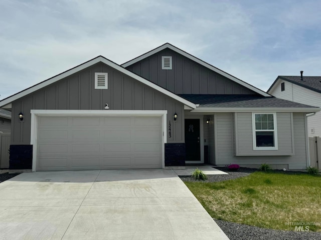 ranch-style house with a front lawn, roof with shingles, board and batten siding, concrete driveway, and an attached garage