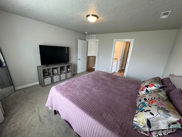 bedroom with a textured ceiling, light colored carpet, visible vents, and baseboards