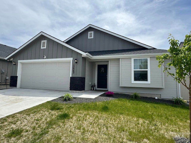 ranch-style house with a front yard, driveway, roof with shingles, a garage, and board and batten siding