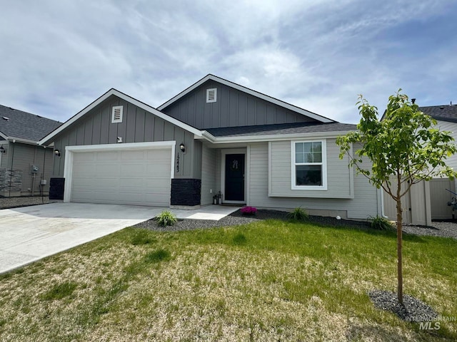 single story home with board and batten siding, a front lawn, concrete driveway, central AC, and an attached garage