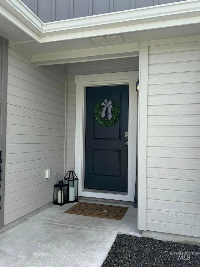 property entrance with board and batten siding