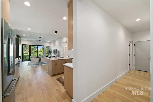 hallway with light wood-type flooring