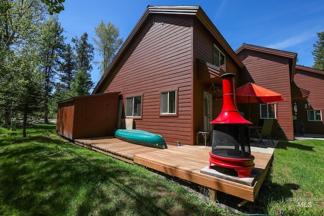 141 Stibnite St Unit 15, Mccall, ID 83638 - rear view of house featuring a deck and a lawn