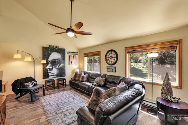 141 Stibnite St Unit 15, Mccall, ID 83638 - living room with ceiling fan, wood finished floors, lofted ceiling, and a baseboard radiator