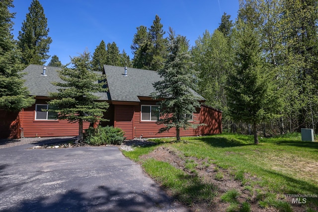 141 Stibnite St Unit 15, Mccall, ID 83638 - chalet / cabin featuring roof with shingles and a front yard