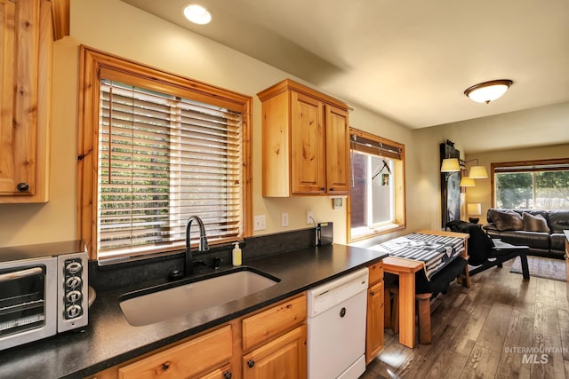 141 Stibnite St Unit 15, Mccall, ID 83638 - kitchen featuring a sink, dishwasher, dark countertops, dark wood-style floors, and open floor plan