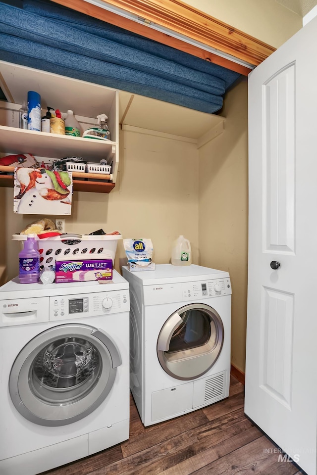 141 Stibnite St Unit 15, Mccall, ID 83638 - washroom with washing machine and dryer and dark wood-style floors