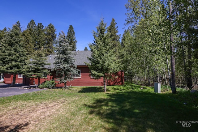 141 Stibnite St Unit 15, Mccall, ID 83638 - view of front facade featuring a front yard and roof with shingles