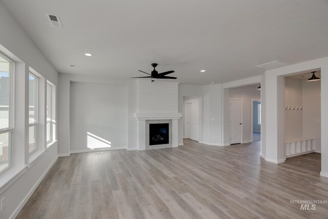 unfurnished living room with recessed lighting, visible vents, and light wood finished floors