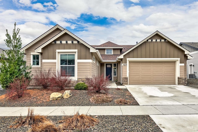 20513 N Glenisla Ave, Boise, ID 83714 - craftsman-style home featuring driveway, stone siding, roof with shingles, an attached garage, and board and batten siding