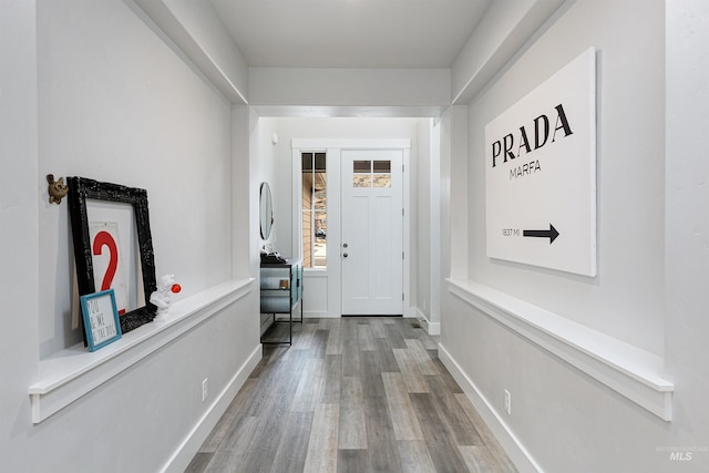20513 N Glenisla Ave, Boise, ID 83714 - doorway with baseboards and wood finished floors