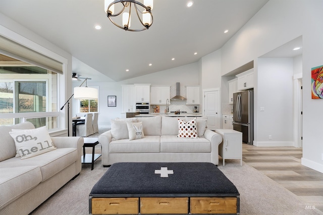 20513 N Glenisla Ave, Boise, ID 83714 - living area featuring an inviting chandelier, high vaulted ceiling, light wood-style floors, and recessed lighting