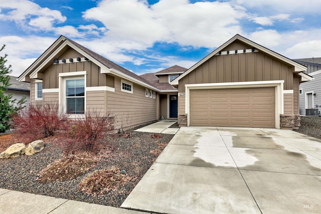 20513 N Glenisla Ave, Boise, ID 83714 - craftsman-style house with concrete driveway, central air condition unit, an attached garage, board and batten siding, and a shingled roof
