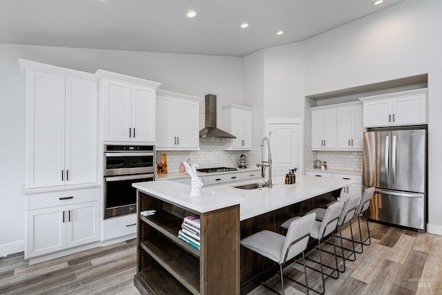 20513 N Glenisla Ave, Boise, ID 83714 - kitchen with light countertops, open shelves, stainless steel appliances, a sink, and wall chimney range hood