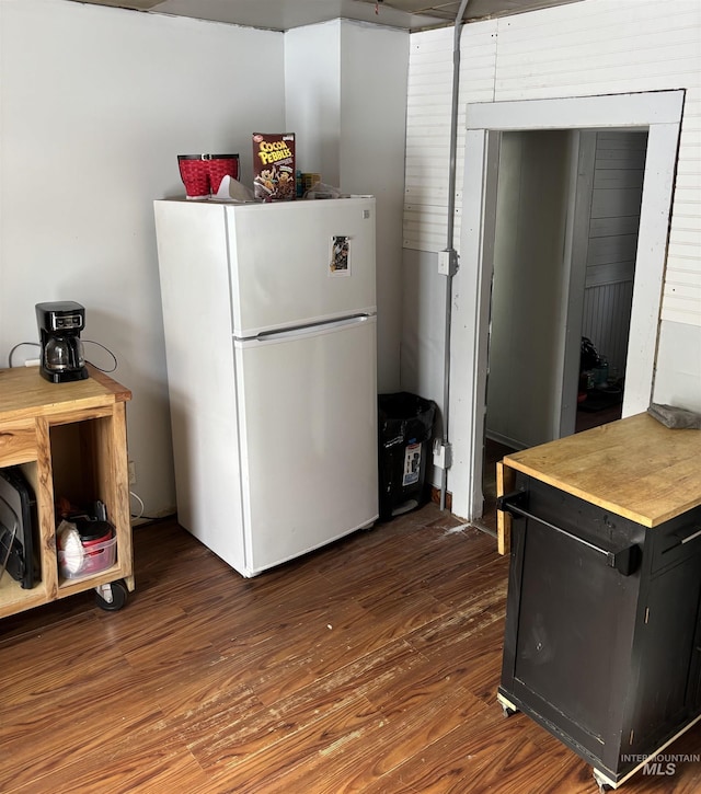 kitchen featuring dark wood-type flooring and white refrigerator