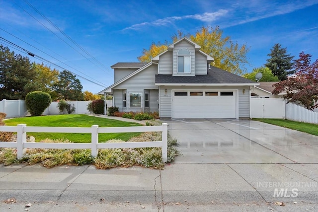 view of front property with a garage and a front yard